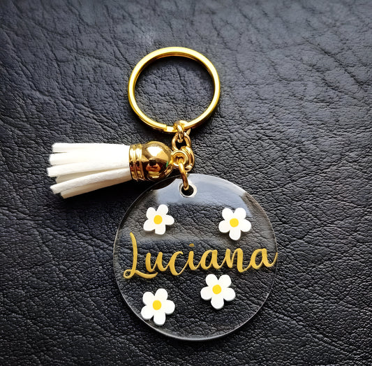 Porte-clés personnalisé rond en acrylique – Prénom doré avec fleurs marguerites et pompon élégant